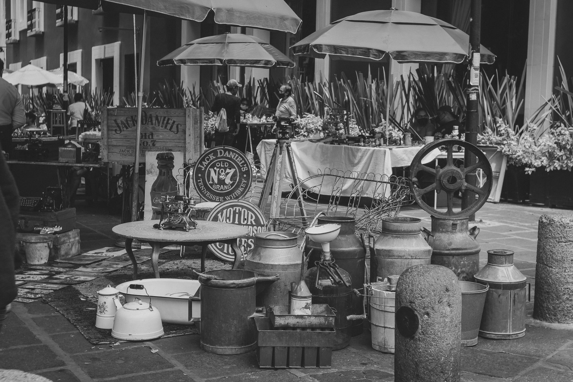 Black and white photo of a vintage stall at a flea market in Puebla, Mexico.